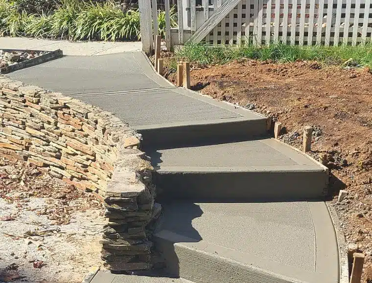 Concrete walkway with two broad entry steps